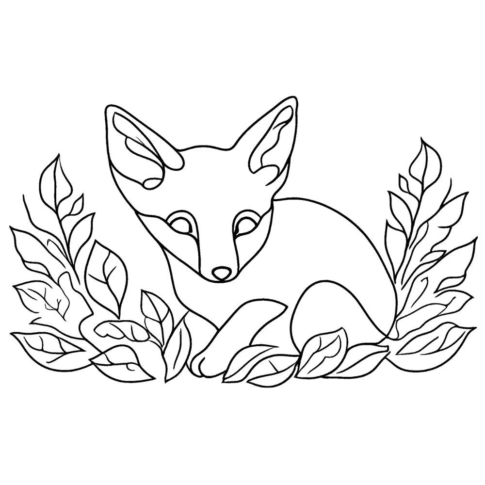 A baby fox in a leaf pile